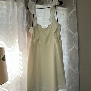 White/cream colored mini dress with ruffled straps